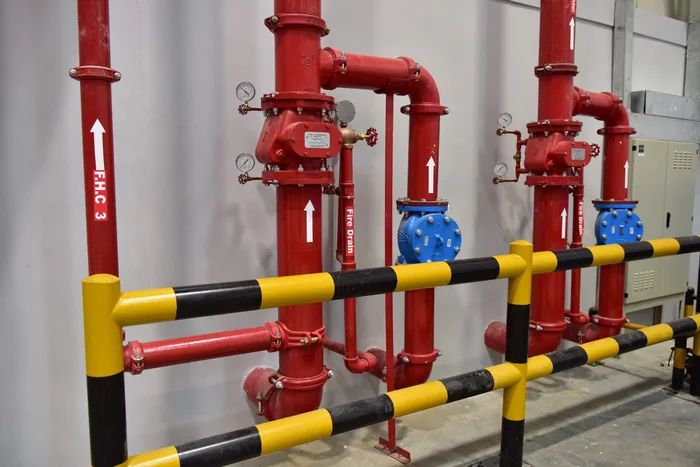 Sprinkler risers with alarm valves and gauges